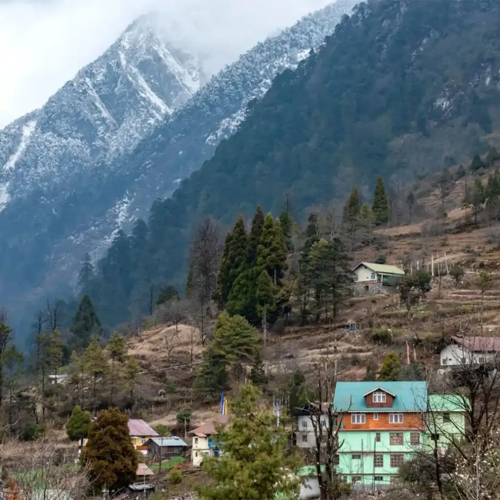How to Reach Lachung: By Road, Train & Flight 3 Lachung covered with a beautiful mountain with snow