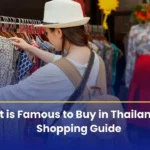 A lady is exploring the market of Thailand, searching for the famous and top things to buy from there.