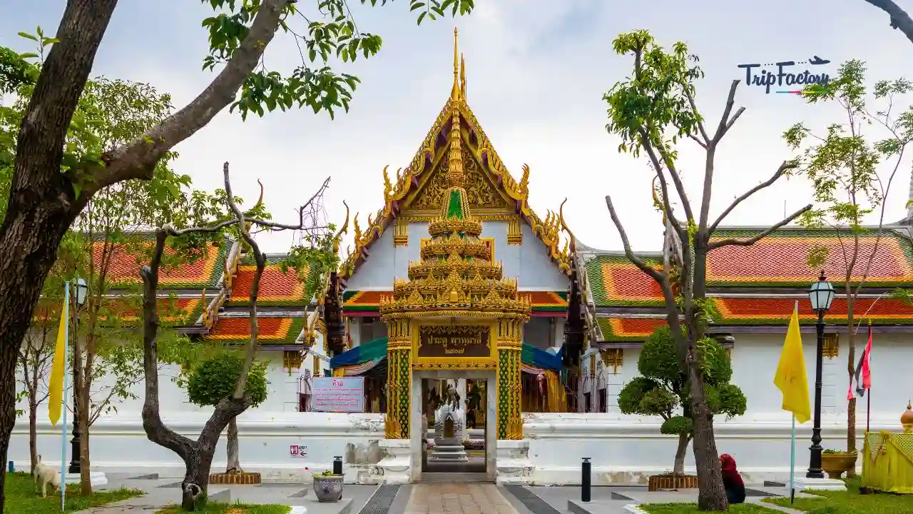 this is a front side image of Wat Rakhang Khositaram with a clear blue sky